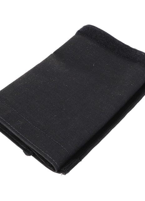 The AGCO HOSE COVER - AL60002977, a folded black fabric piece with a Velcro fastener, effortlessly blending style and functionality.