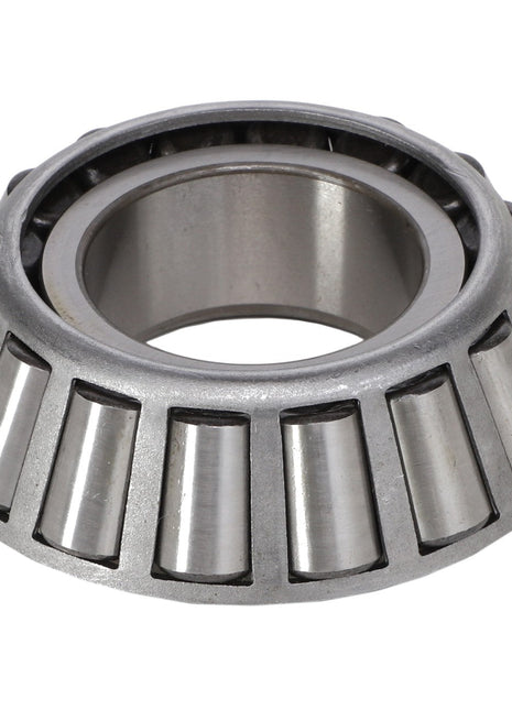 The AGCO | BEARING - AG132710 is a tapered roller bearing, featuring metallic cylindrical rollers arranged in a cone shape, designed to efficiently handle both radial and thrust loads.