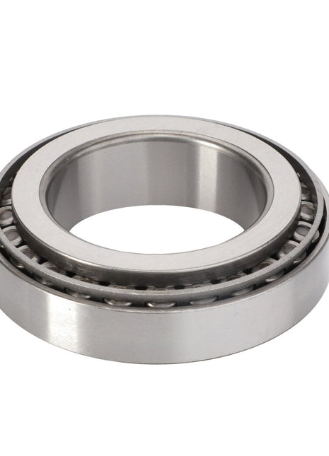 The AGCO Taper Roller Bearing - F334310020670 is a metallic cylindrical component with an inner and outer ring, designed to reduce rotational friction while supporting radial and thrust loads in machinery.