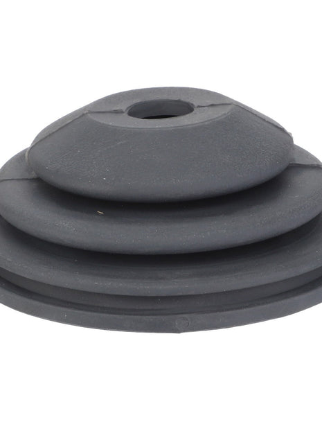 The AGCO | BELLOWS - F716974160020 is a sleek black rubber grommet that features a layered, conical shape with a central hole for versatile applications.