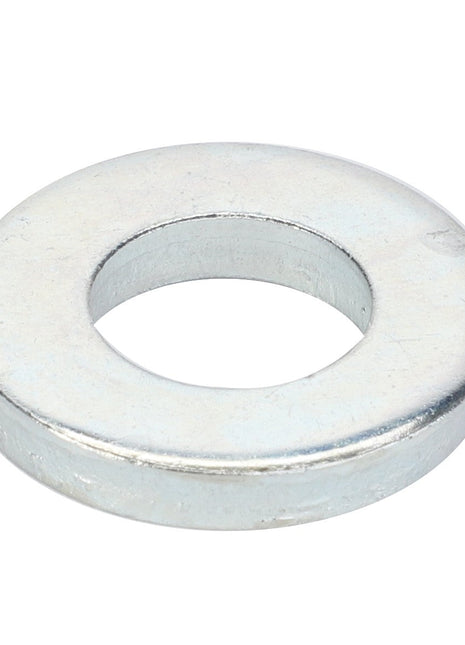 The AGCO BUSH - D28181284 is a silver-colored metal washer with a circular shape and a central hole, designed to distribute the load of a threaded fastener.