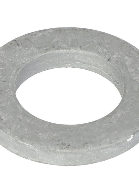 A close-up of the AGCO Flat Washer - Acw1628390, a silver metallic washer featuring a round central hole, typically used in conjunction with bolts and nuts in mechanical assemblies.