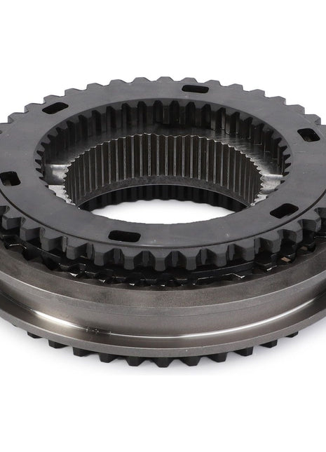 Close-up of the AGCO Synchro Unit - 3799206M94, a metal mechanical gear assembly with interlocking teeth, featuring an exterior and interior ring with intricate detailing. Likely used in machinery or automotive applications, this component is ideal for Fendt Fitment or Massey Ferguson Models equipped with Dyna-6 transmissions.