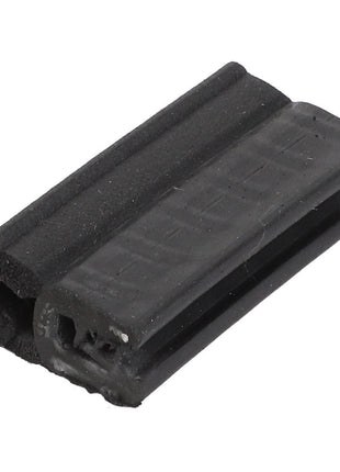 Close-up of the AGCO Seal - Acw5500070, a black rubber weather stripping seal with a grooved and flanged profile, designed for insulating doors and windows, featuring intricate craftsmanship.