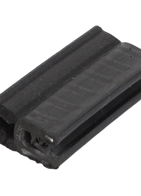 Close-up of the AGCO Seal - Acw5500070, a black rubber weather stripping seal with a grooved and flanged profile, designed for insulating doors and windows, featuring intricate craftsmanship.