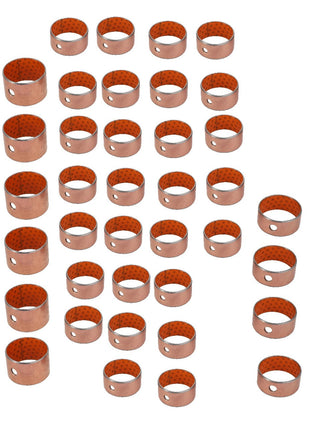 A collection of AGCO cylindrical copper bushings, part number AL5018914, meticulously arranged in rows and columns on a pristine white background.