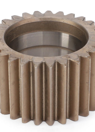 A durable metal planetary gear with straight teeth and a circular central hole, resting on a white surface, exemplifies the AGCO | Planetary Gear - F712301020240 by AGCO, known for enhancing machinery performance.