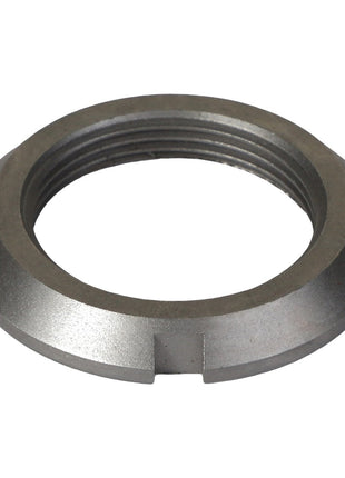 A close-up view of the AGCO LOCKNUT - AG332708 reveals a metallic, threaded lock nut featuring four small notches around its outer edge, offering a distinctive design that is easily noticeable even without a current product description.