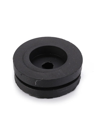 The AGCO Grommet (LA10397580) is a circular black rubber grommet featuring a central hole and a recessed groove around its edge, providing essential functionality.