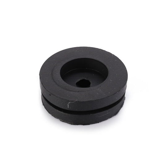 The AGCO Grommet (LA10397580) is a circular black rubber grommet featuring a central hole and a recessed groove around its edge, providing essential functionality.