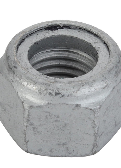 Close-up of the AGCO Hex Top Lock Nut - Acx2967670, a metallic hexagonal nut with an open threaded center. The nut shows signs of wear and a slightly rough surface texture. No current product description information is available for this item from AGCO.