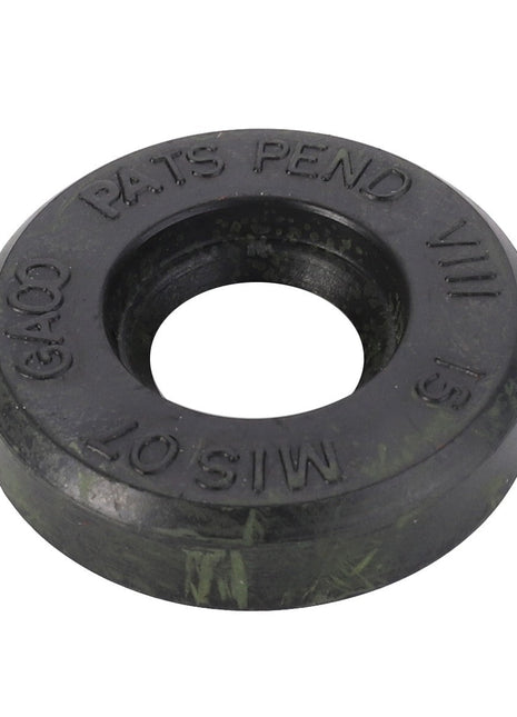 Close-up of a round, black, heavy-duty washer with a large central hole and embossed text "PATS PEND MIS 07 GA00 SIS 151" on its surface, identified as AGCO | Seal - 1850980M1, compatible with Valtra machinery.