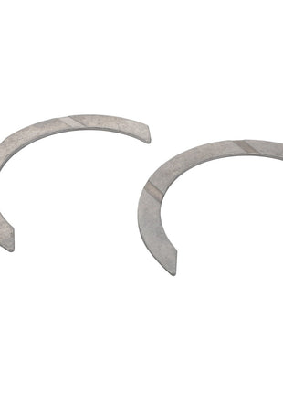 AGCO Thrust Washers model F716201310220, featuring two semi-circular metallic components with flat surfaces and notched features, arranged on a white background. No current product description information is available.