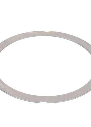 A flat, circular metal washer with a hole in the center often used in mechanical assemblies. Product: AGCO | Ring, For Cylinder Head Height Compensation - F390200210100.
