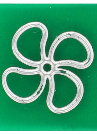 A green square tile featuring a silver outline of a four-petal flower in the center, now identified as the AGCO Symbol Lens for an Air Circulation Fan - V30944900. Further product description details are currently unavailable.