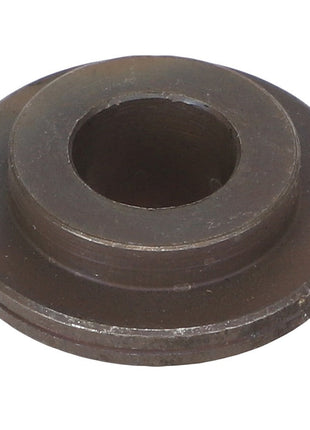 A circular, dark metal washer with a central hole and a slightly raised outer rim from AGCO, known as the AGCO Bush - Acw2425810. Unfortunately, no current product description information is available.