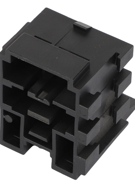 A black, rectangular plastic electronic connector featuring multiple slots and ridges for fitting components, known as the AGCO | CONNECTOR - AG517569 by AGCO.