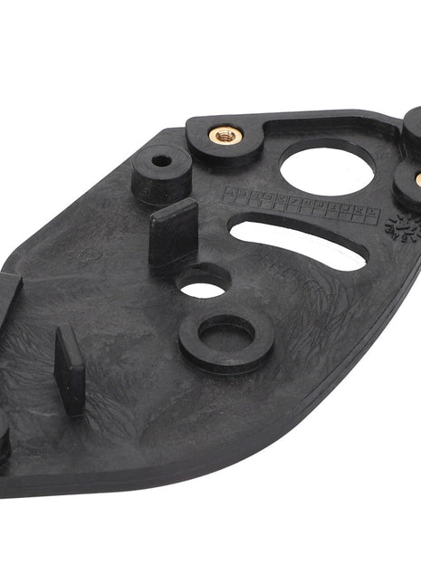 The AGCO Counterplate - 4279928M1 features a black plastic construction with multiple holes, raised areas, and embedded brass fittings on a flat, uniquely irregularly shaped base.