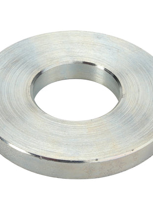 Introducing the AGCO | HINGE - D28182590, a meticulously crafted large circular metal washer designed with a central hole, boasting a smooth polished surface and uniform thickness.