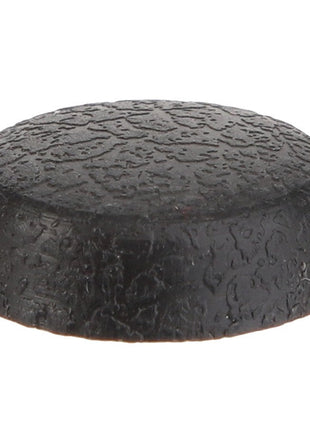 A close-up of a single black rubber end cap with a textured surface, typically used to protect or cover the end of a cylindrical object. The product is known as AGCO | CAP - D28982543 by the brand AGCO.