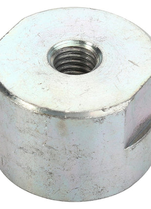 Currently, there is no detailed product description available for the AGCO Spacer - Acp0419550. However, this silver hexagonal nut, branded by AGCO, features an internal thread and is commonly used with a bolt. It has a slightly worn and brushed metallic surface.