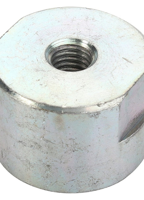 Currently, there is no detailed product description available for the AGCO Spacer - Acp0419550. However, this silver hexagonal nut, branded by AGCO, features an internal thread and is commonly used with a bolt. It has a slightly worn and brushed metallic surface.