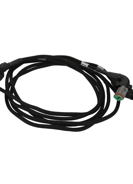 The AGCO Harness - Acw1390670, a coiled black electrical wiring harness from AGCO, is meticulously designed with multiple connectors on each end to ensure seamless connectivity and optimal performance.