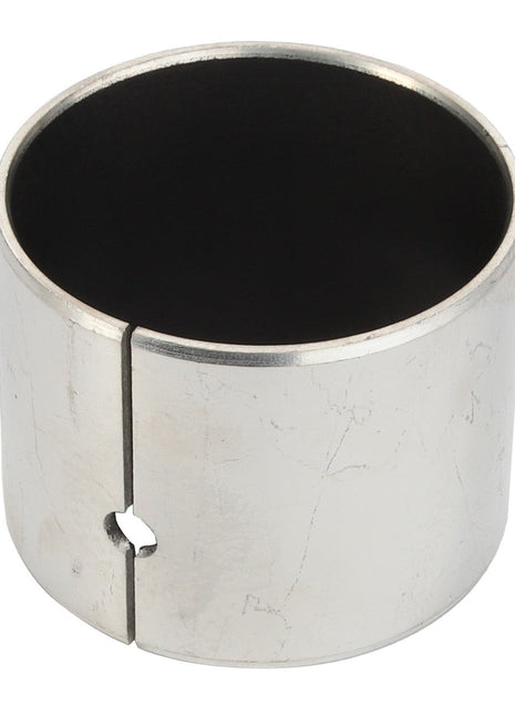 The AGCO Bush - Acp0287030 is a cylindrical metal bushing with a small notch and visible surface wear, featuring a hollow center. No current product description is available.