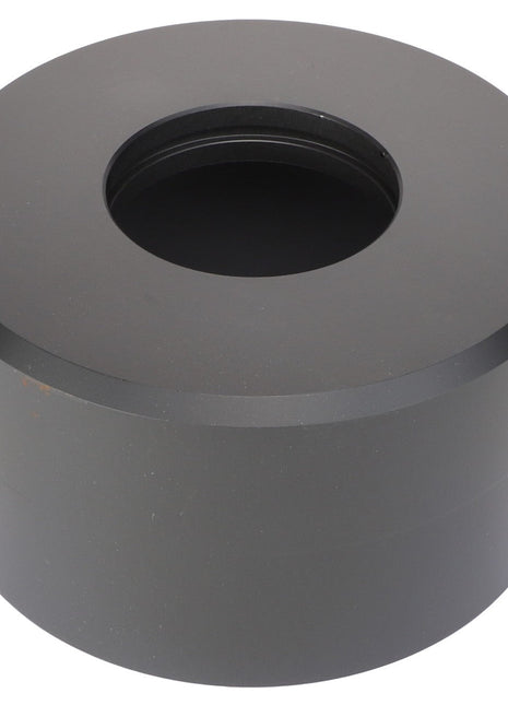 This is an AGCO | Piston Housing - Acw9087410, a cylindrical metal object with a large central hole. The top and bottom surfaces are flat, and the sides are smooth. Currently, no additional product description information is available for this item.