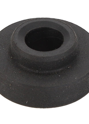 The AGCO Bush - Acp0336290, a black rubber grommet from the AGCO brand, is designed with a central hole to insulate and protect wires or cables passing through metal openings.