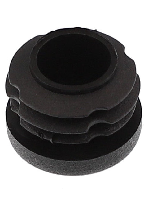 Close-up of an AGCO Plug - Acw2039850, featuring a black rubber grommet with a ridged design, ideal for sealing holes or protecting wires. No current product description information is available.