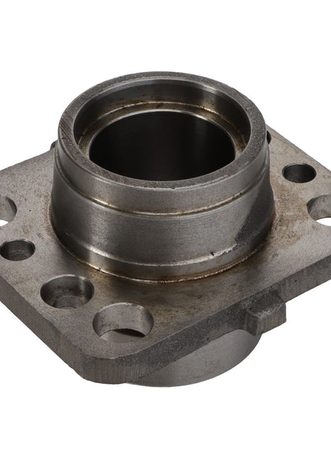 The AGCO Bearing Carrier - D44126200 is a metal mechanical component featuring a central cylindrical opening, a flanged base with four mounting holes, and visible signs of wear. No current product description information is available for this item.