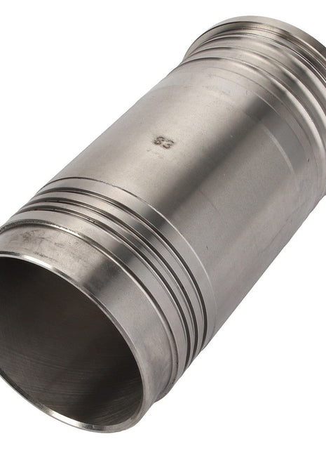 The AGCO | Cylinder Liner - V836336331 is a metal cylindrical pipe connector with a grooved surface and flared ends, crafted using high-quality materials and modern manufacturing technologies.