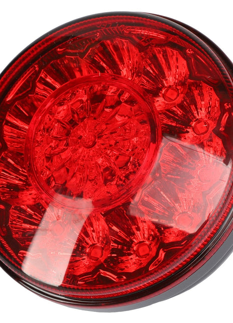 The AGCO Lamp - Acw1518880 is a circular red LED tail light featuring a reflective surface and an intricate internal design. No current product description information is available.