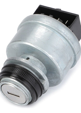 The AGCO Ignition Switch - 4295836M2 features a round metal key switch and a rectangular black base, specifically designed for integration into electrical or mechanical systems, and is frequently used in Massey Ferguson models.