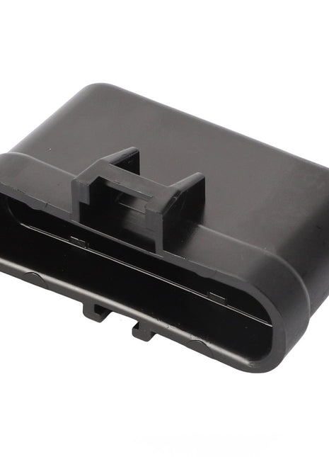 The AGCO Electrical Plug Cap - AG519698 is a black plastic connector featuring an oval shape and a clip on the top.