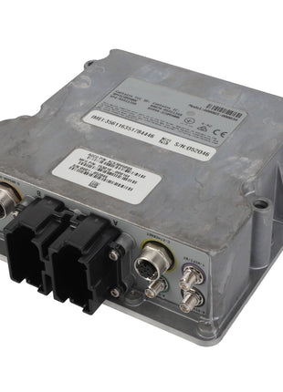 The AGCO Module - Acx304608A, a product from AGCO, is a metal electronic control module with various ports and connectors. It features data labels with printed numbers and barcodes, and its rectangular unit boasts a rugged design.