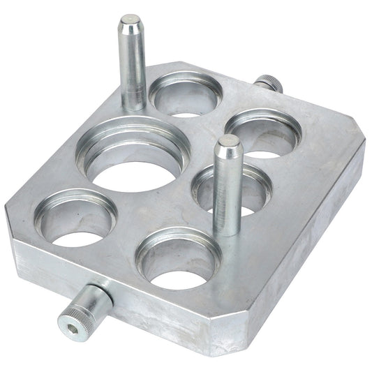 The AGCO CONNECTOR PLATE - ACW0538800 is a rectangular metal plate with five circular holes and three cylindrical pegs protruding from the surface. Currently, no additional product description information is available.