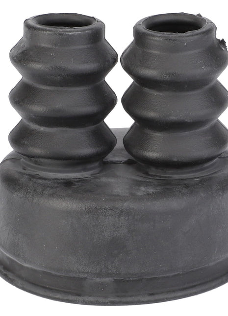 The AGCO | RUBBER SHIELD - V30420700, a black rubber grommet with two ribbed cylindrical extensions side by side, is expertly designed for sealing and protecting wires or cables, ensuring durability and efficiency.