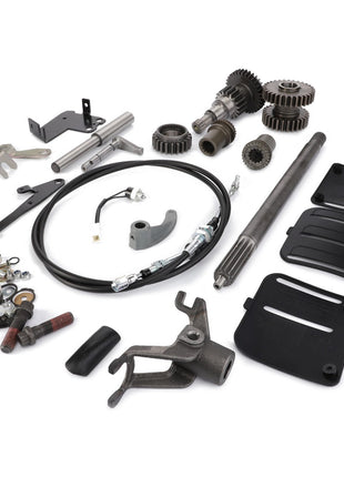 The AGCO | Pto Kit - Acw1401580, featuring an assortment of mechanical components such as gears, cables, brackets, and hardware from the renowned brand AGCO, is meticulously arranged on a white background.