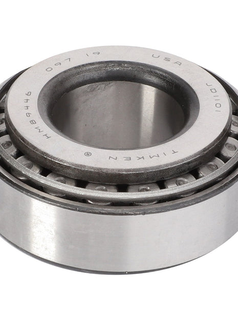 A close-up of the AGCO Taper Roller Bearing - Va140869 with engraved text along the edge, essential for Massey Ferguson models in the off-road industry.