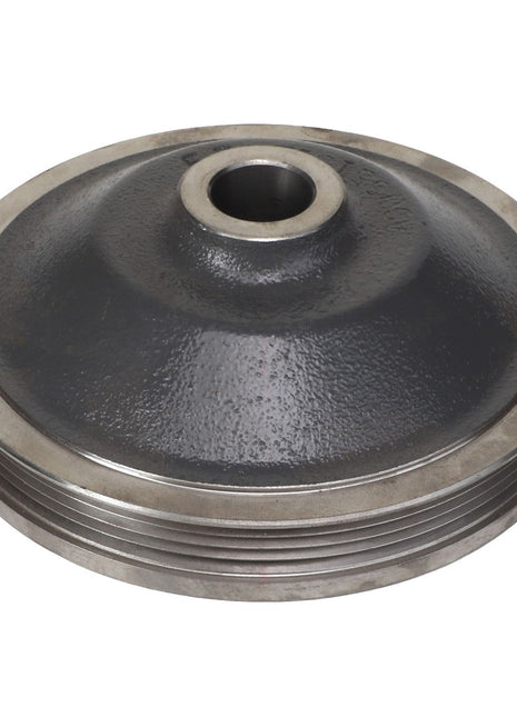 The AGCO Sheave - Acw5513130, a vintage metal pulley featuring a central hole and intricate grooves around its edge, is viewed from an angle, showcasing its robust design and craftsmanship.