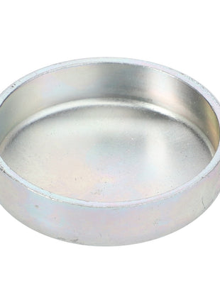 A circular metal AGCO plug, model La14329901, featuring raised edges, displayed against a plain white background. No current product description is available.