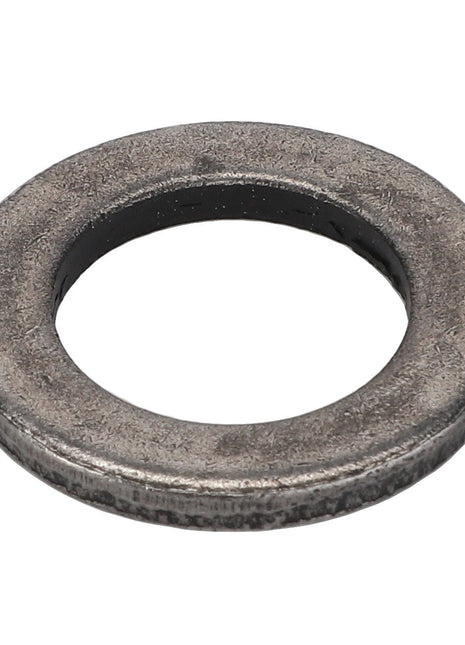 A close-up image of the AGCO Disc - F716300020100, exhibiting a circular metallic design with a central hole. The textured finish of this AGCO washer adds to its rugged appeal.