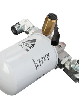 The AGCO Kit, Filter - Acw0891000 is a fuel filter assembly designed for use in diesel engine systems, featuring a white cylindrical filter, metal connectors, and a brass valve. No current product description information is available.