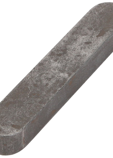 The AGCO Parallel Key - 3006635X1 is a metal rectangular bar with rounded edges, featuring a tarnished and slightly textured surface.