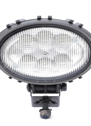 The AGCO | Work Light, LED - ACW3783570 is a round, black automotive fog light with a ribbed glass lens that ensures optimal visibility and features mounting hardware attached at the bottom.