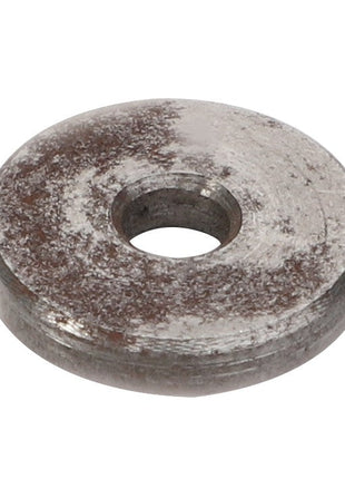 AGCO | Disc - 0910-80-03-00: A close-up view of a metal disc with a central hole, featuring a slightly tarnished surface.