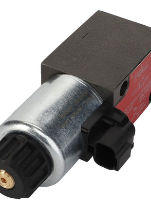 The AGCO Control Valve - Acp0498380 is a metallic solenoid valve with cylindrical and rectangular components, featuring a connector and a red labeling plate. No product description available.