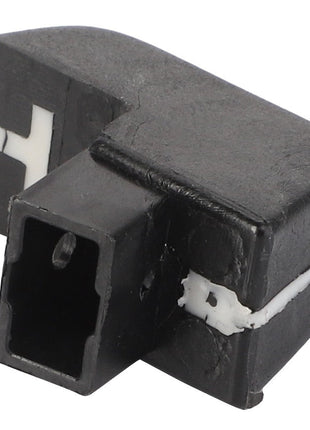 The AGCO Knob - Acp0475710, a sleek black plastic electrical connector, features a rectangular port and distinct white markings on its surface.